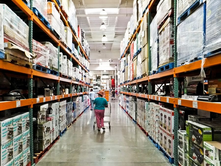 Busy Costco aisle with a variety of food items
